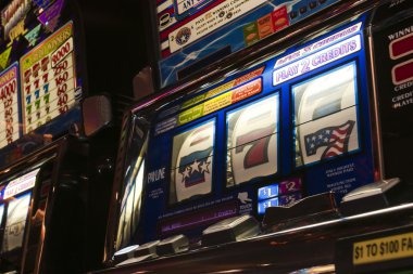 Multi-currency live dealer interface showing currency indicators and betting limits